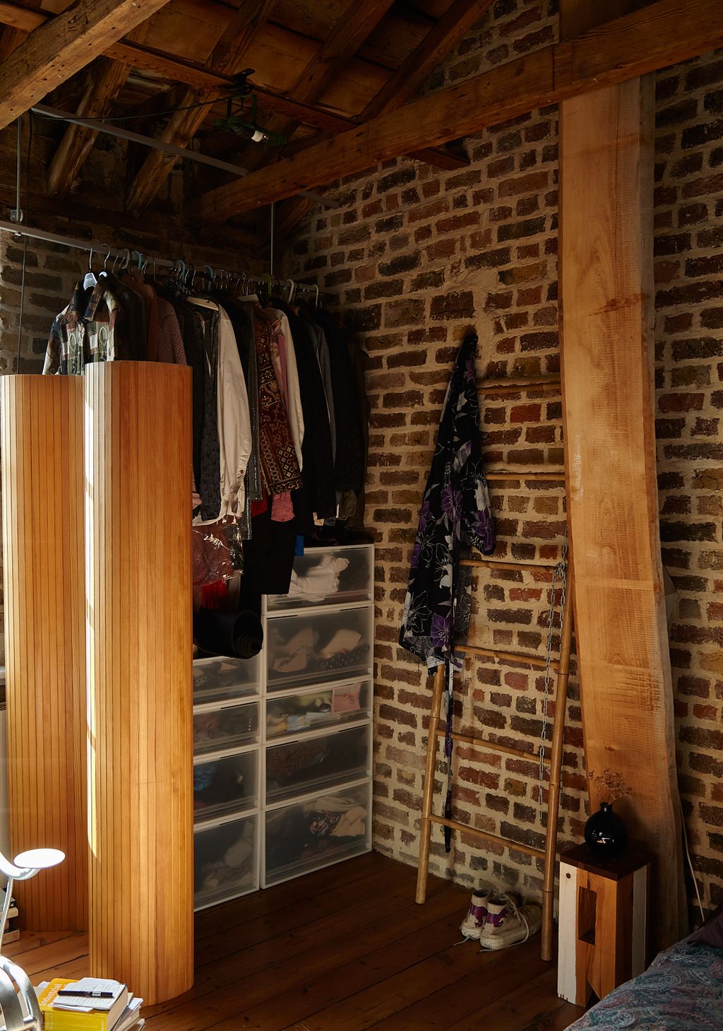 Image may contain Indoors Interior Design Wood Clothing Footwear Shoe Furniture Bed Hardwood and Person