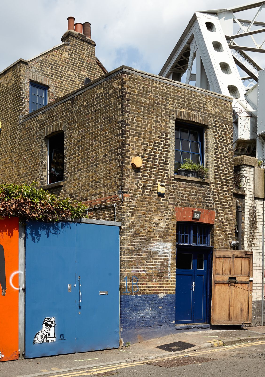 Image may contain City Road Street Urban Brick Plant and Person