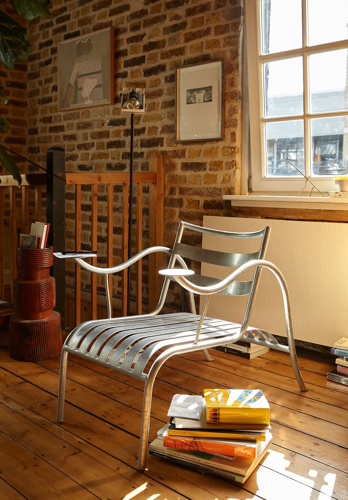 Image may contain Indoors Interior Design Wood Hardwood Chair Furniture Floor Plywood Flooring Art and Painting