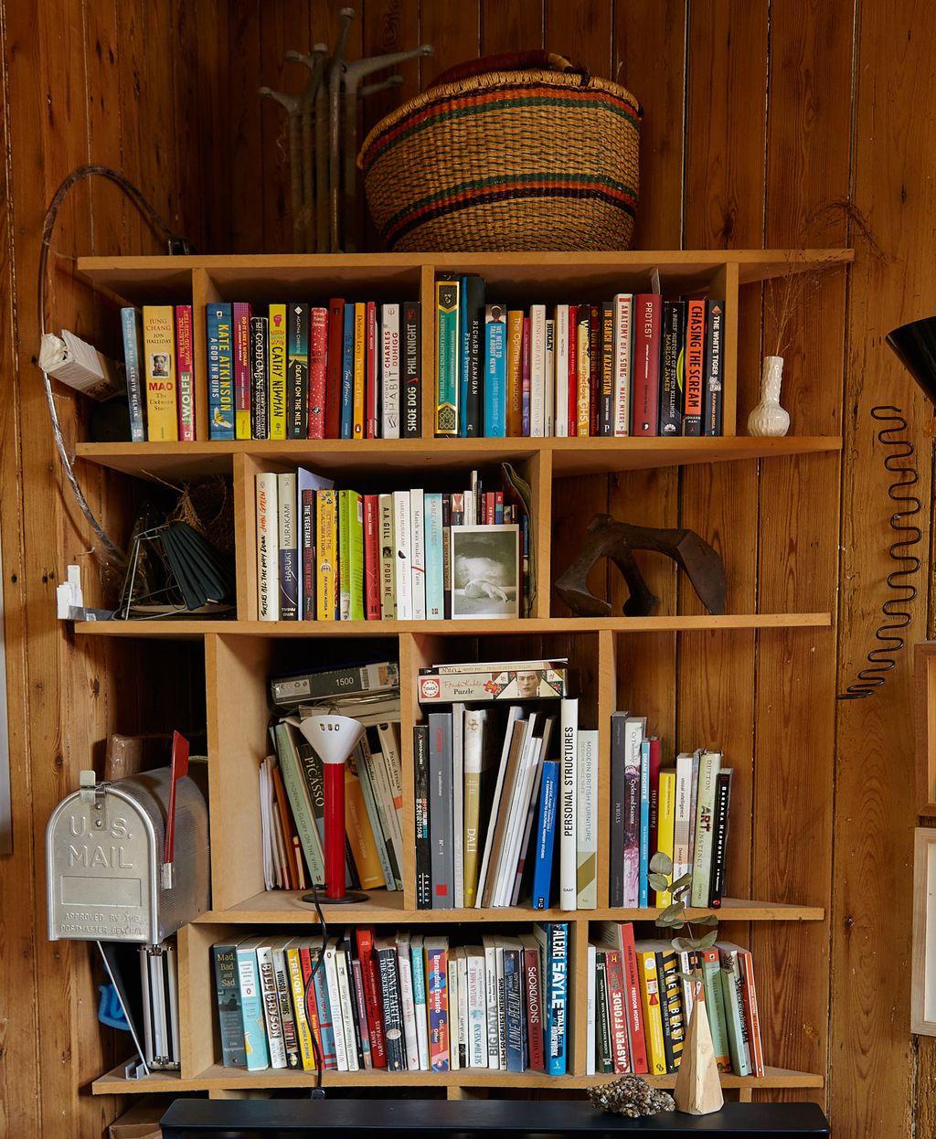 Image may contain Furniture Bookcase Accessories Bag Handbag Person and Wood