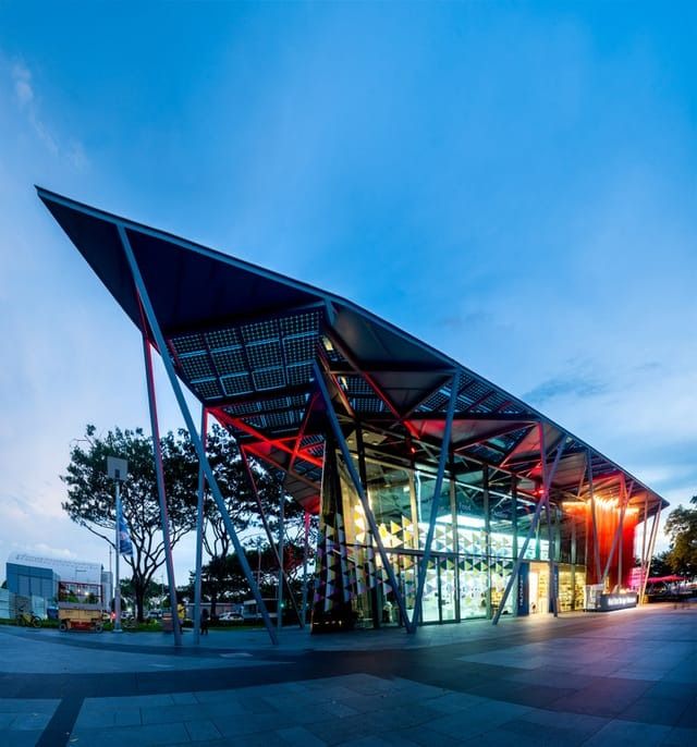 Image may contain Architecture Building Outdoors Shelter Convention Center Terminal Person Urban and Car