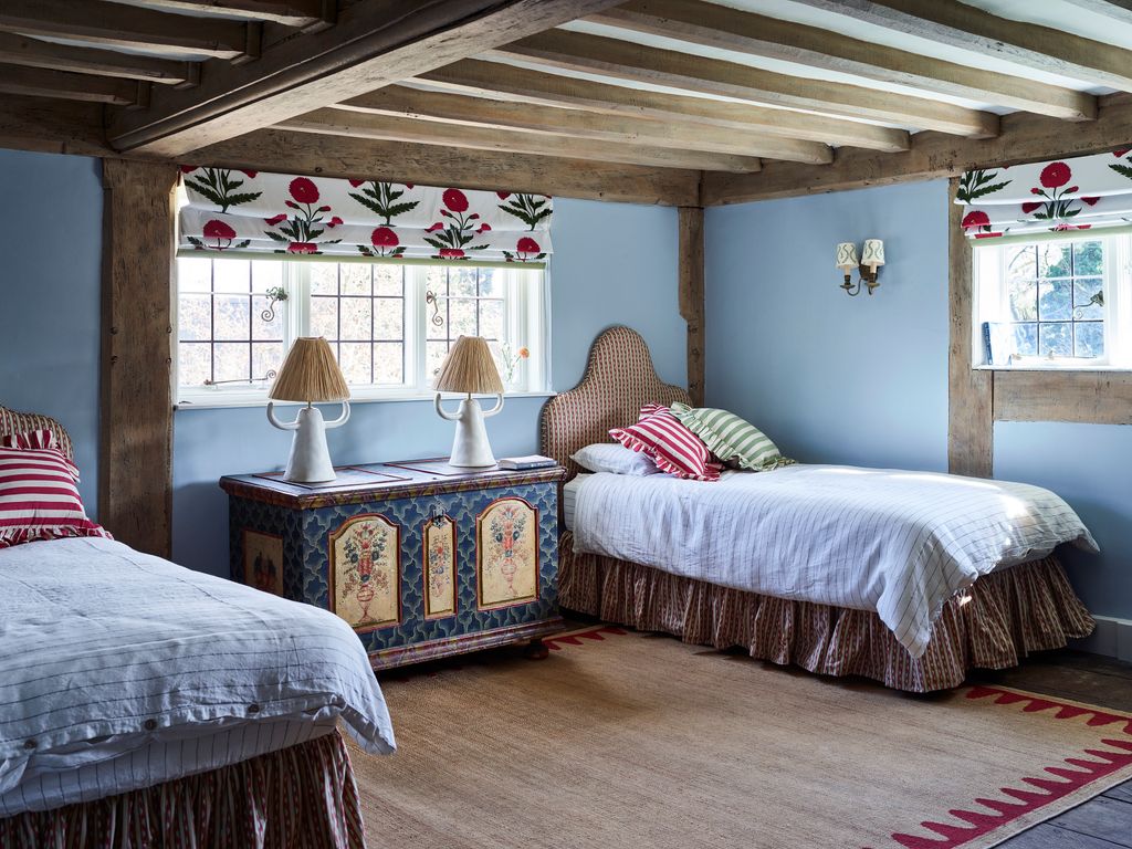 Image may contain Lamp Bed Furniture Indoors Interior Design Home Decor Bedroom Room Dorm Room and Rug