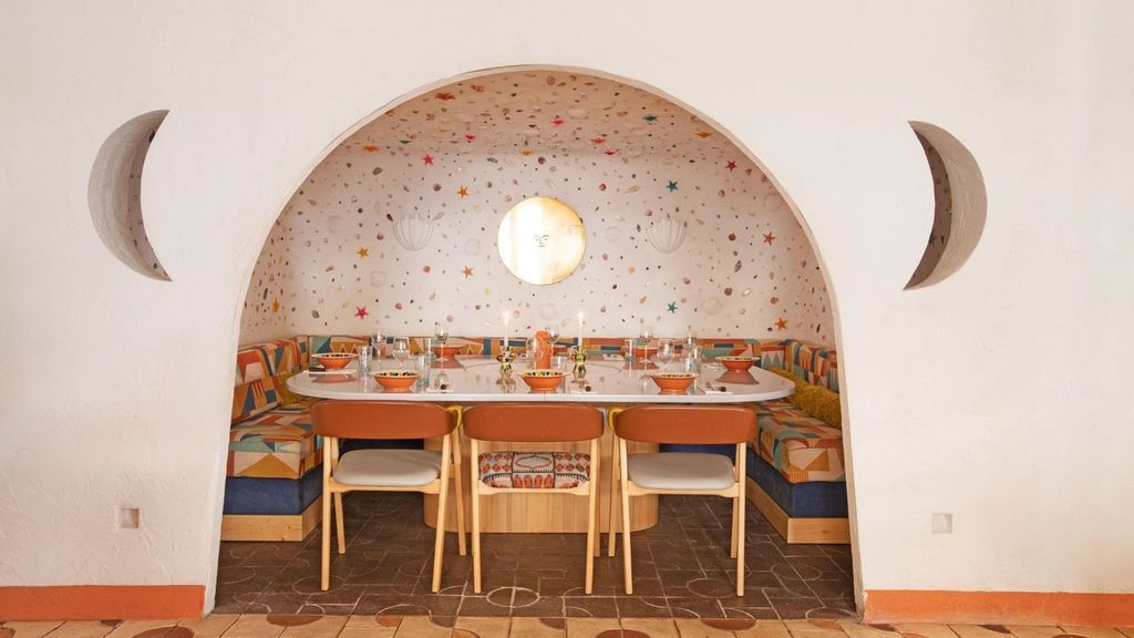 Image may contain Architecture Building Dining Room Dining Table Furniture Indoors Room Table Restaurant and Chair