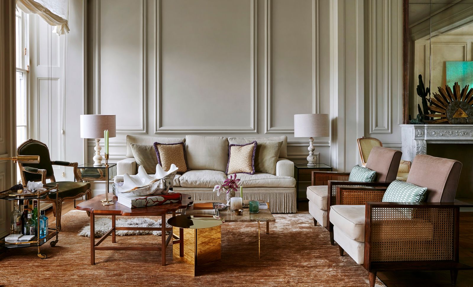 Image may contain Home Decor Lamp Furniture Table Couch Chair Architecture Building Indoors Living Room and Room