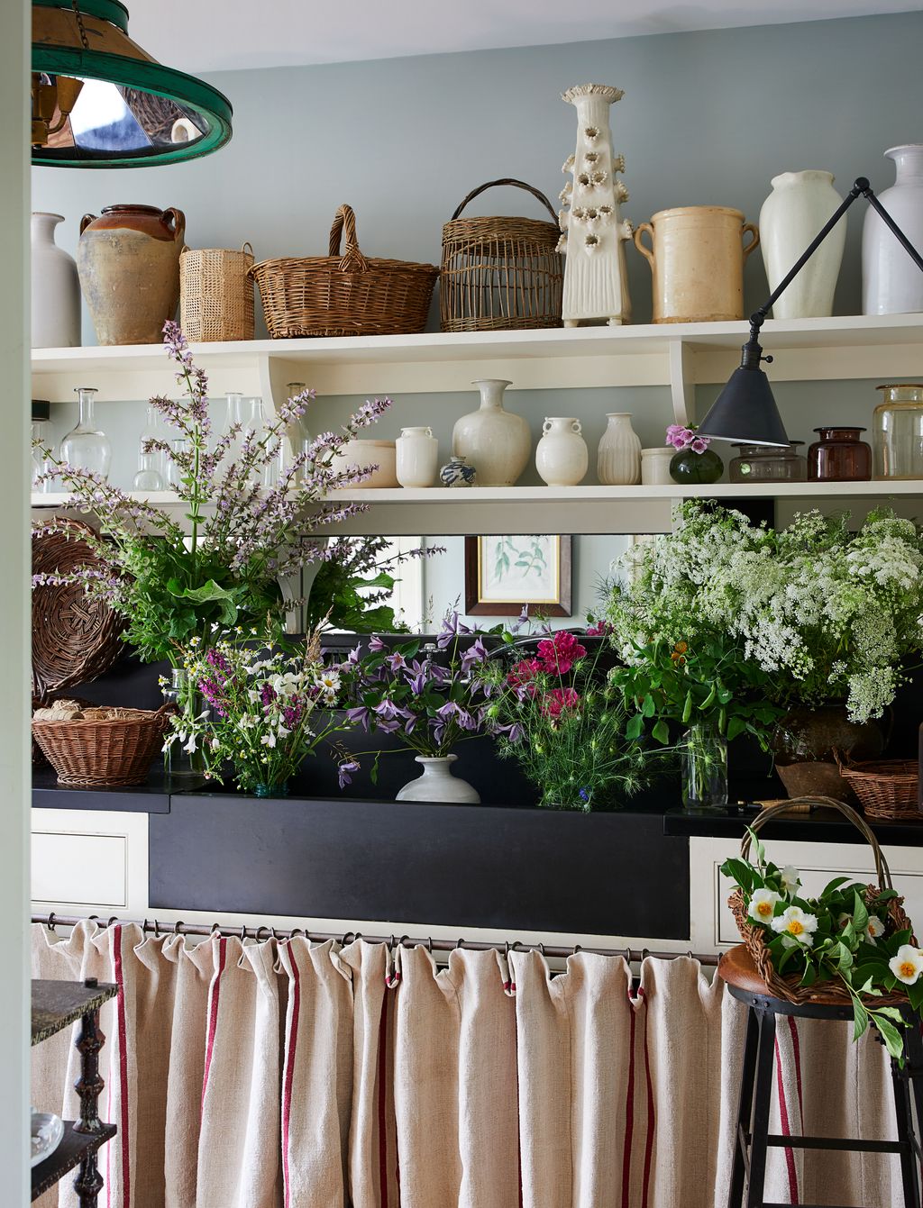 Image may contain Indoors Interior Design Flower Flower Arrangement Plant Art Painting Potted Plant and Furniture