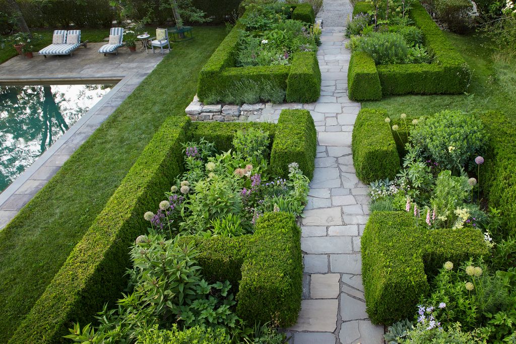 Image may contain Garden Nature Outdoors Grass Park Plant Backyard Yard Chair Furniture Fence Hedge and Path