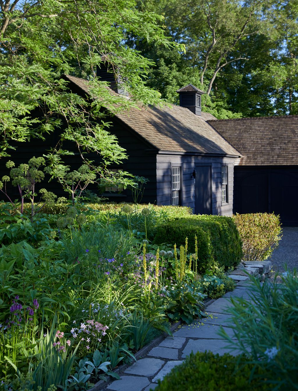 Image may contain Architecture Building Cottage House Housing Garden Nature Outdoors Grass Plant and Vegetation