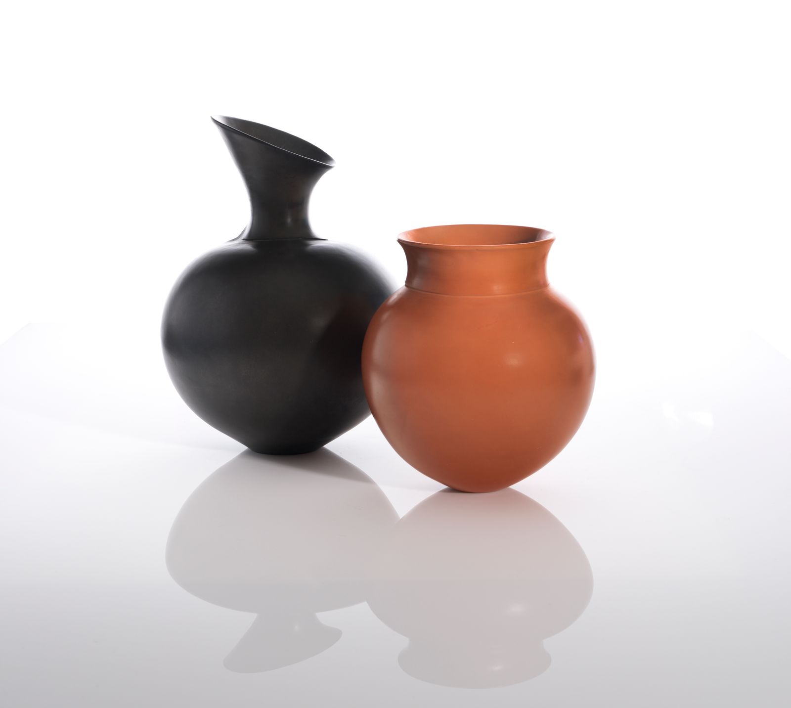 Image may contain Jar Pottery Vase Cookware Pot and Smoke Pipe