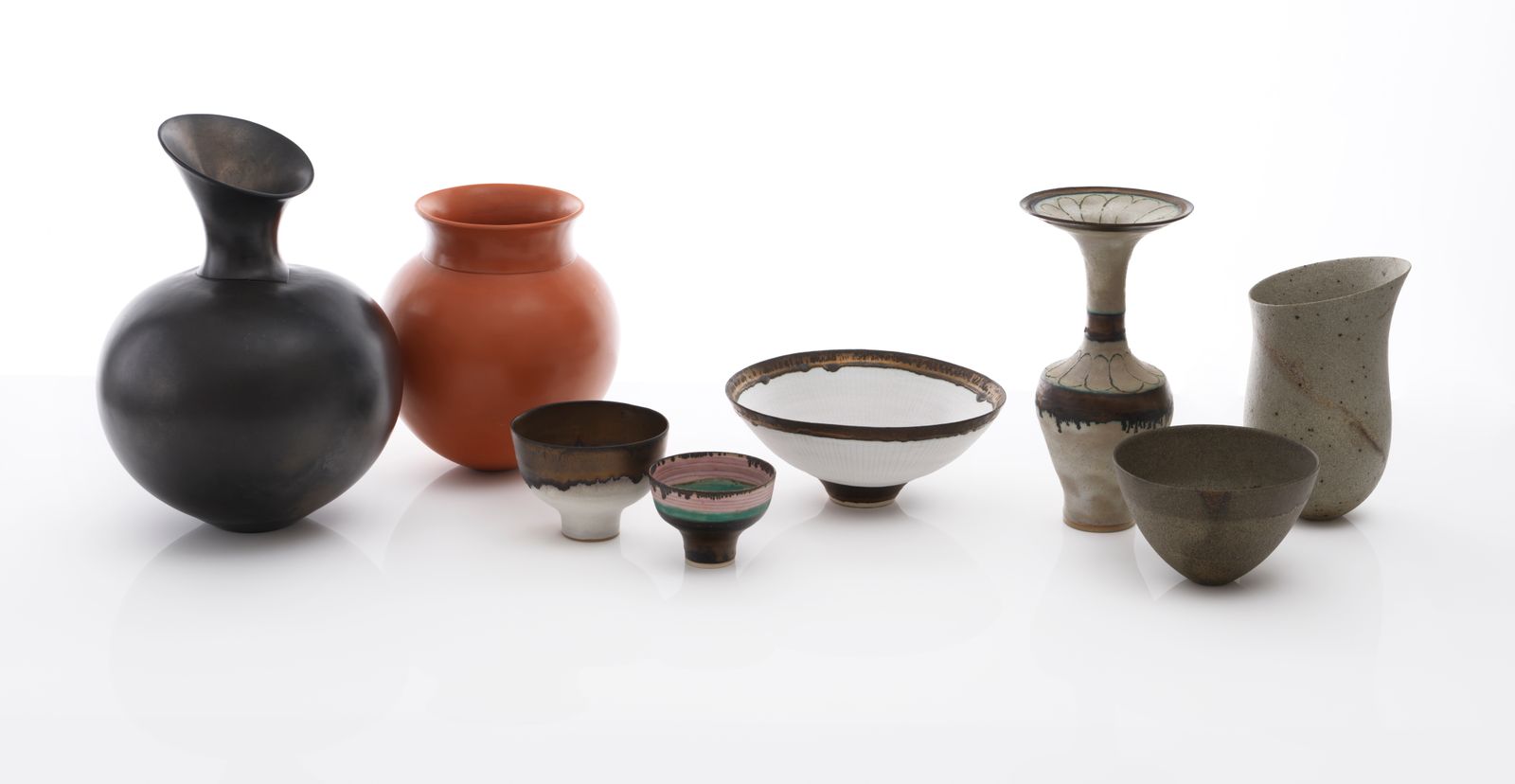 Image may contain Pottery Jar Cup and Smoke Pipe