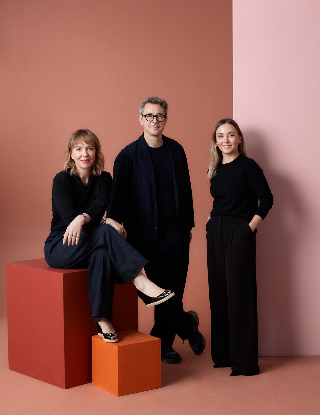 Image may contain Adult Person Clothing Footwear Shoe Groupshot Accessories Glasses Face Head and Photography