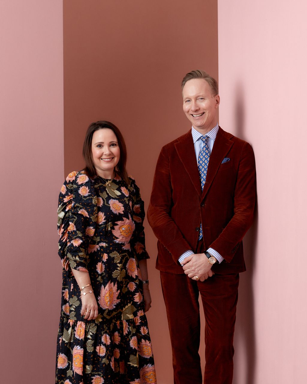 Image may contain Blazer Clothing Coat Jacket Adult Person Formal Wear Suit Wristwatch Accessories and Tie