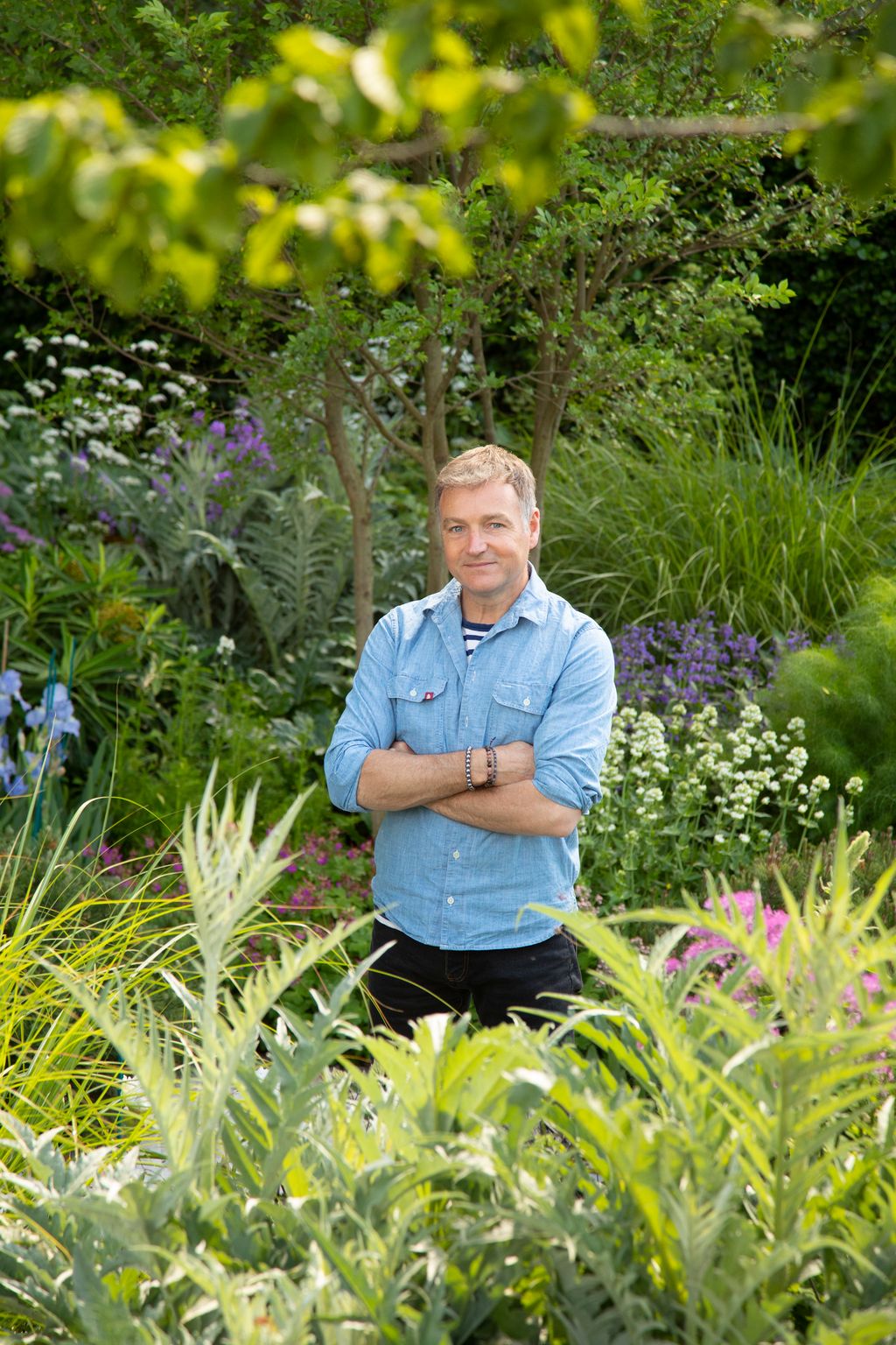 Image may contain Chris Beardshaw Garden Nature Outdoors Herbal Herbs Plant Adult Person Gardening and Vegetation