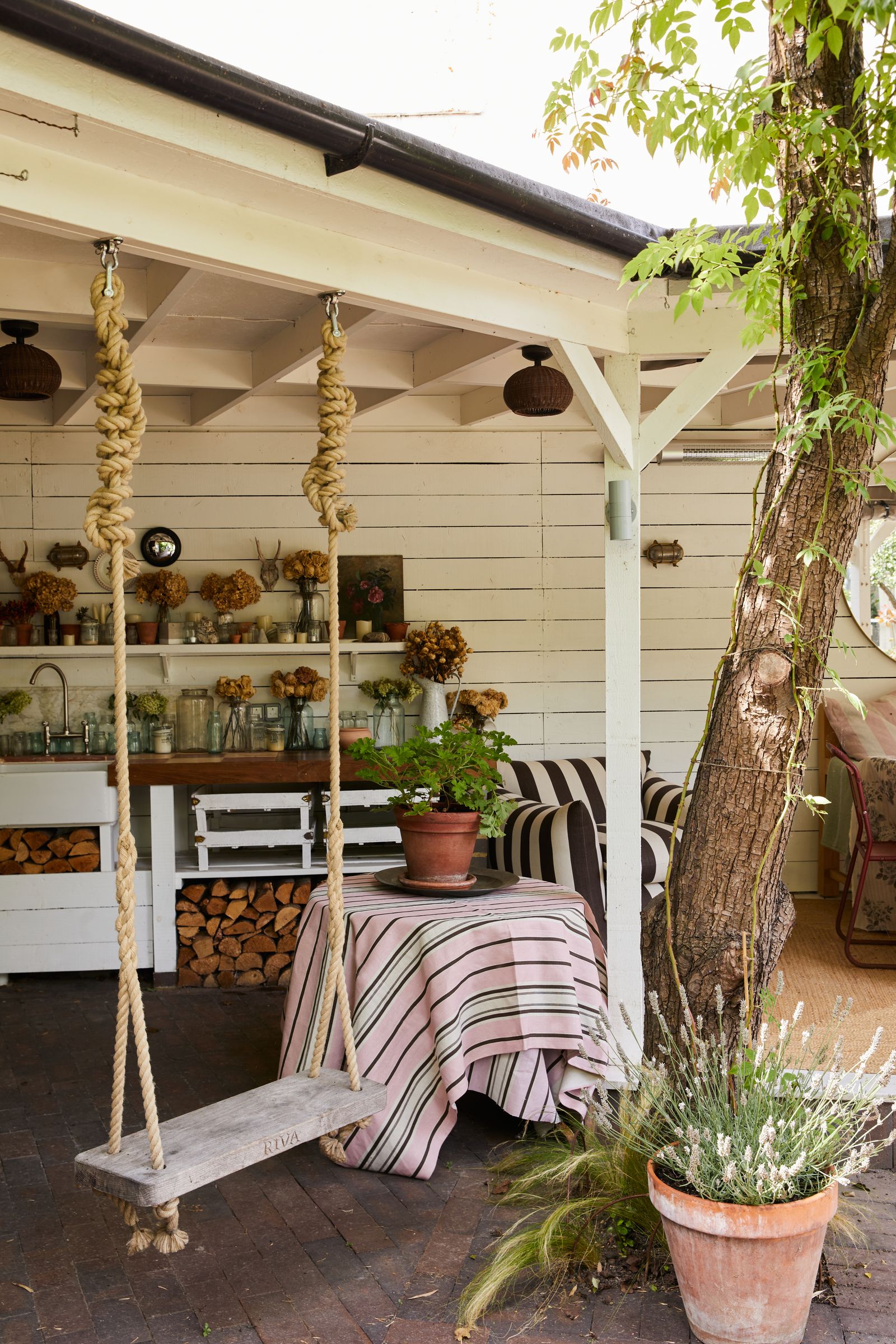 Image may contain Indoors Interior Design Plant Potted Plant Architecture Building House Housing Porch and Jar