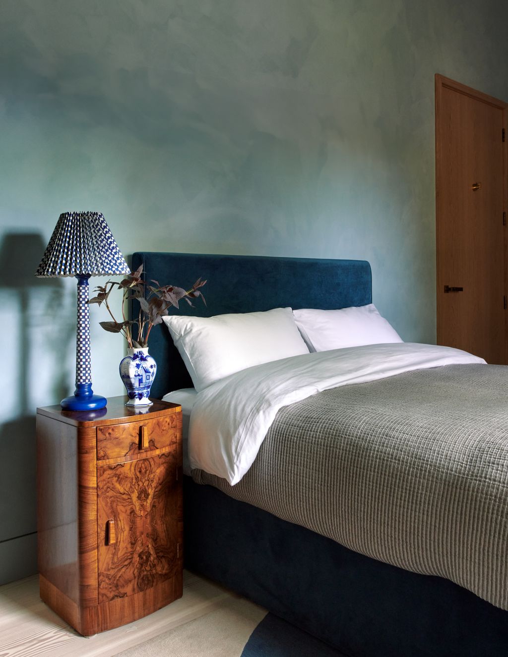 Image may contain Lamp Table Lamp Bed Furniture Cushion Home Decor Indoors Interior Design Pillow Bedroom and Room