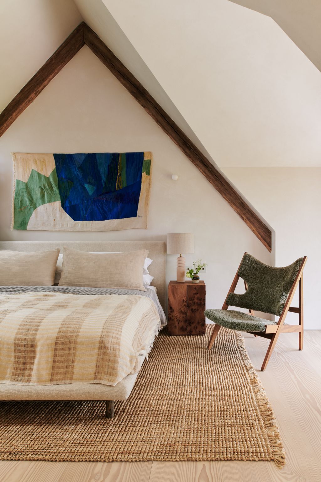Image may contain Home Decor Lamp Chair Furniture Rug Bed Indoors Interior Design Architecture Building and House