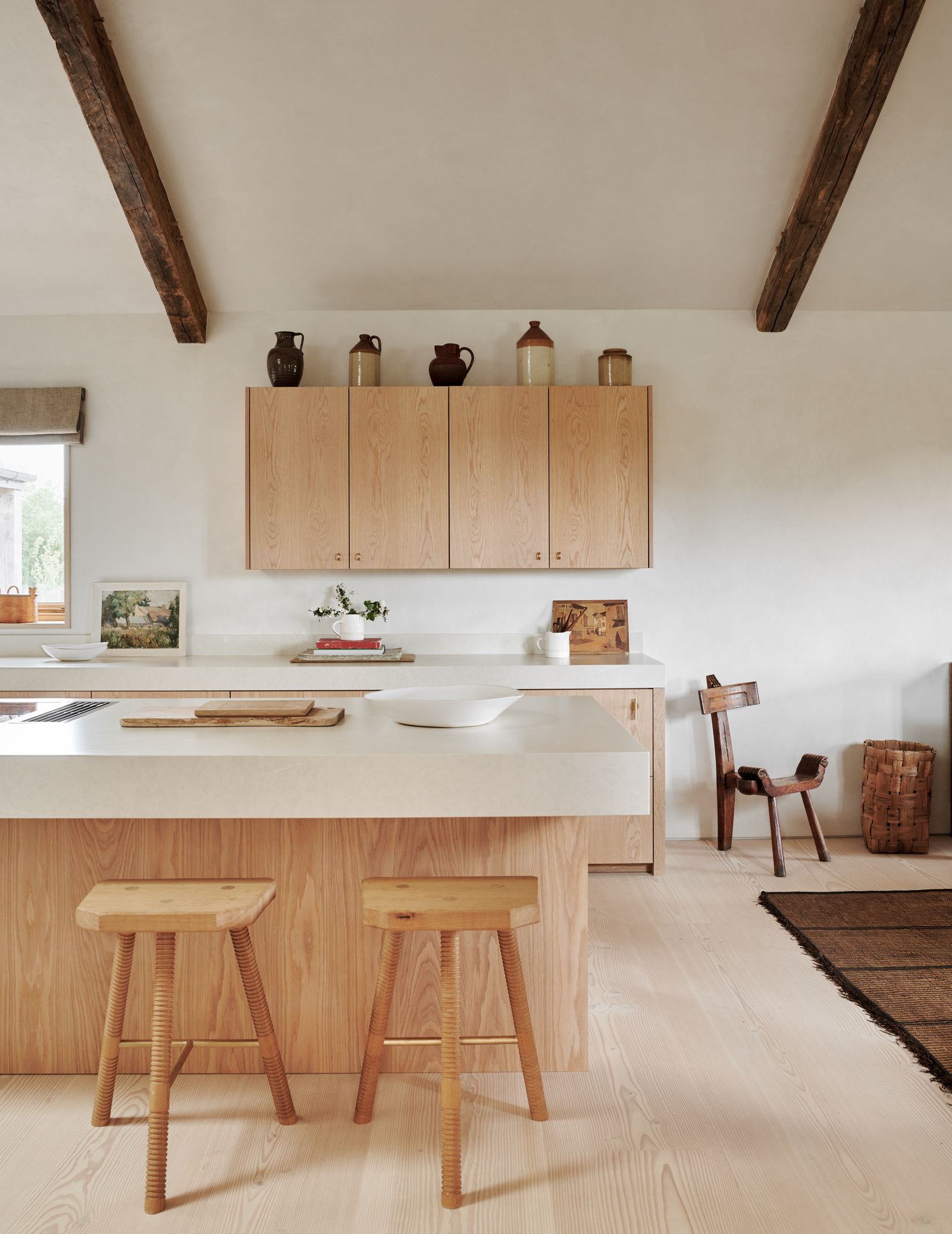 Image may contain Indoors Interior Design Wood Chair Furniture Bar Stool Kitchen Home Decor Rug Cup and Plant