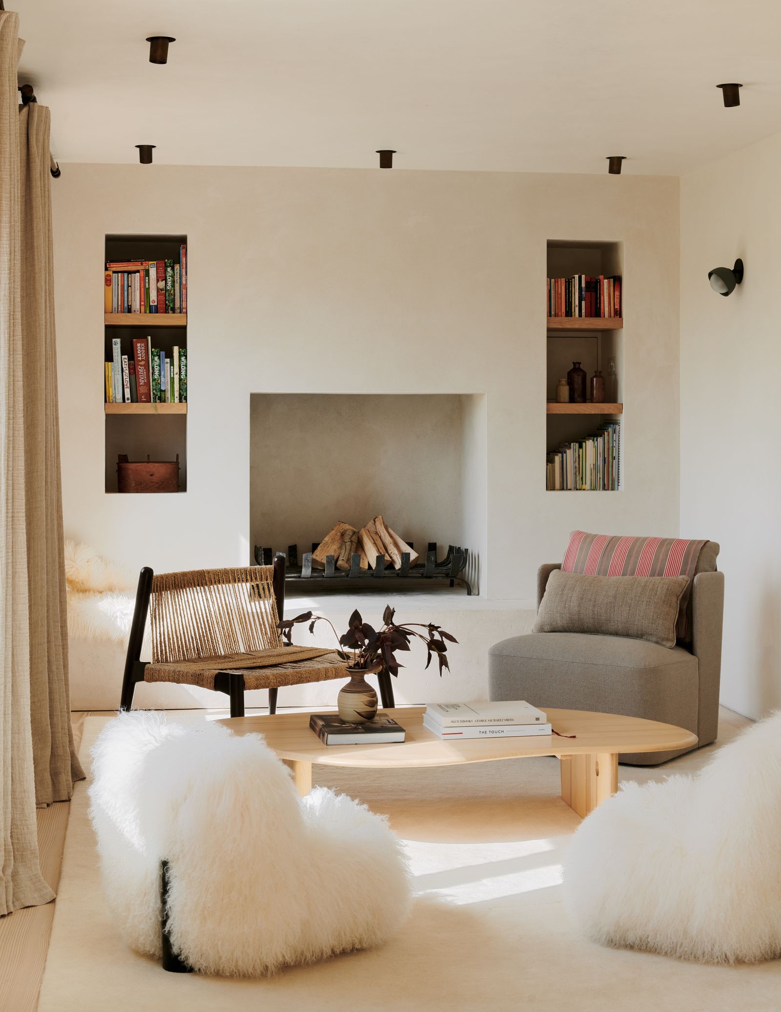Image may contain Home Decor Book Publication Furniture Coffee Table Table Couch Lamp Architecture and Building