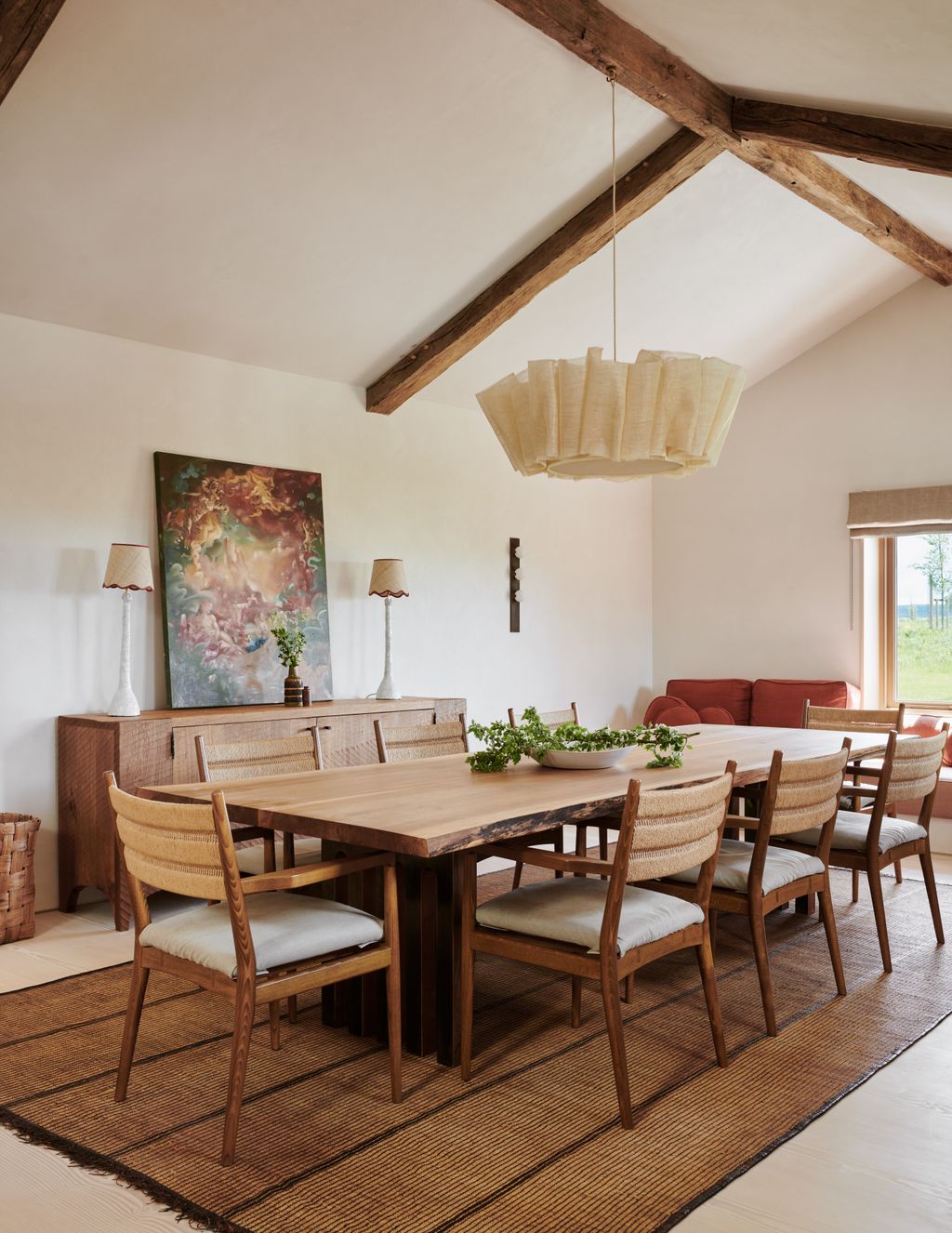 Image may contain Architecture Building Dining Room Dining Table Furniture Indoors Room Table Home Decor and Lamp
