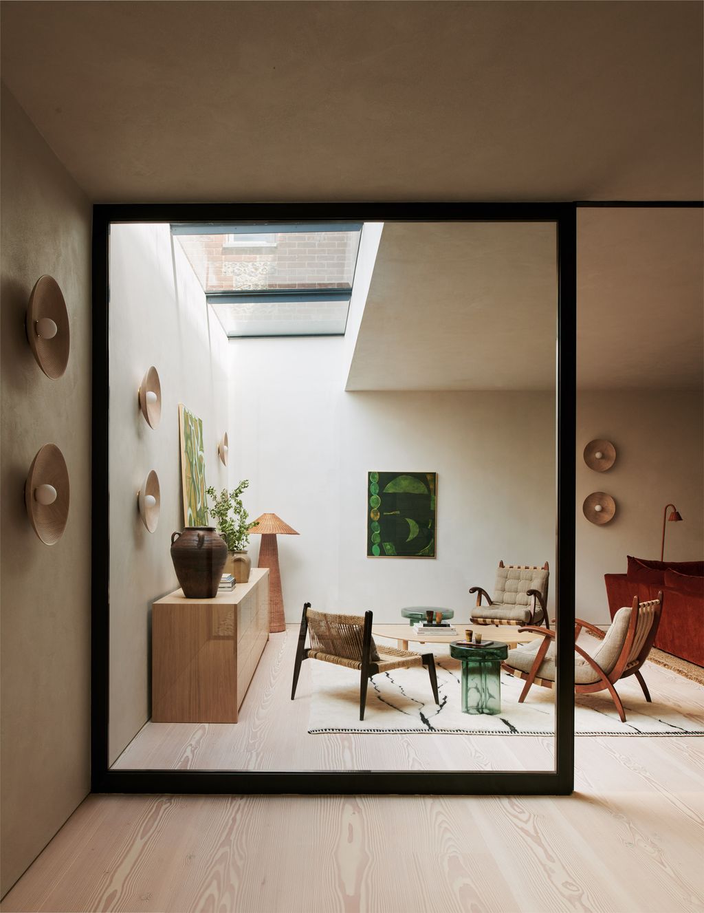 Image may contain Indoors Interior Design Lamp Plant Home Decor Chair Furniture Window Architecture and Building