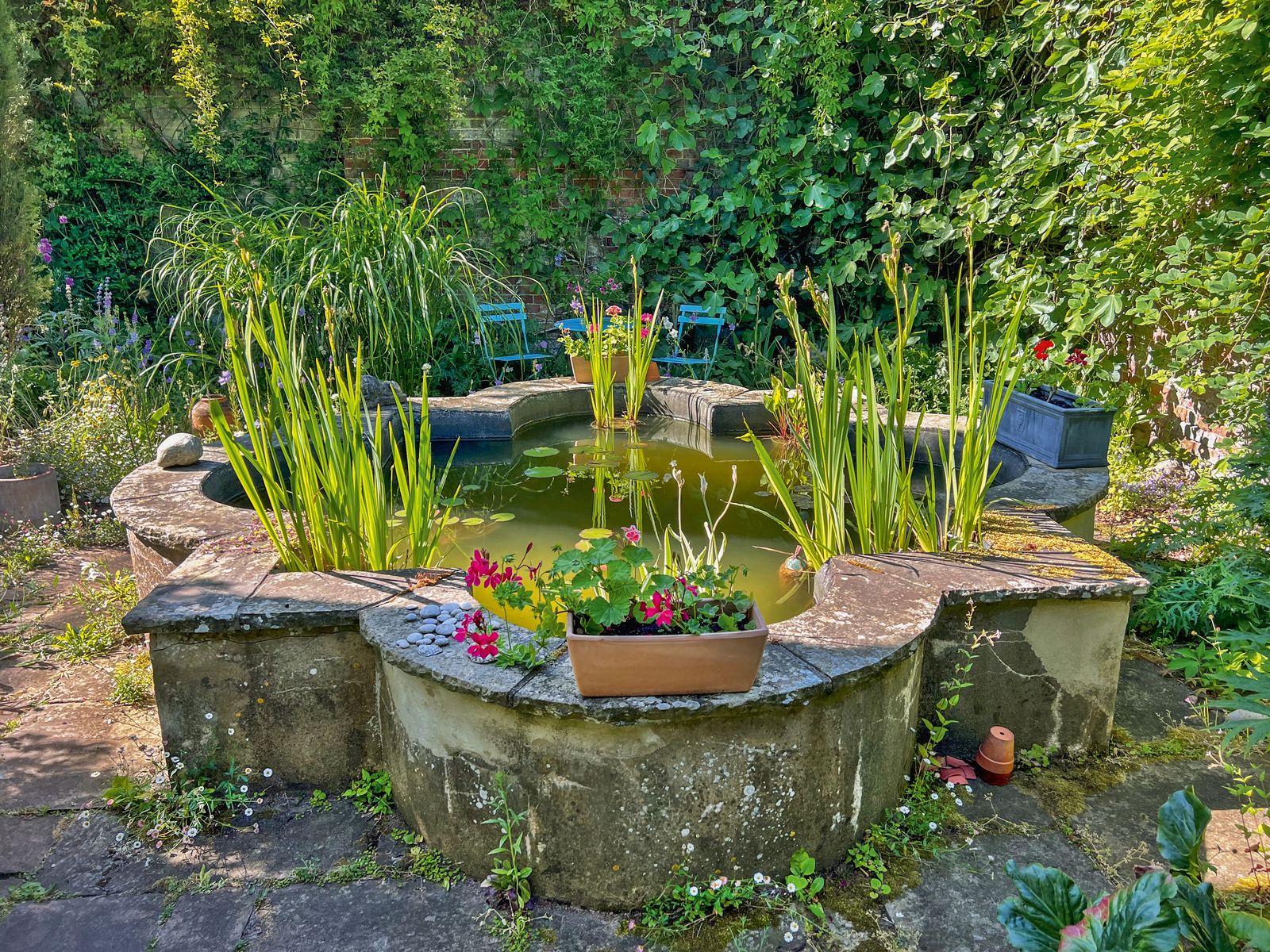 Image may contain Nature Outdoors Pond Water Garden Chair and Furniture