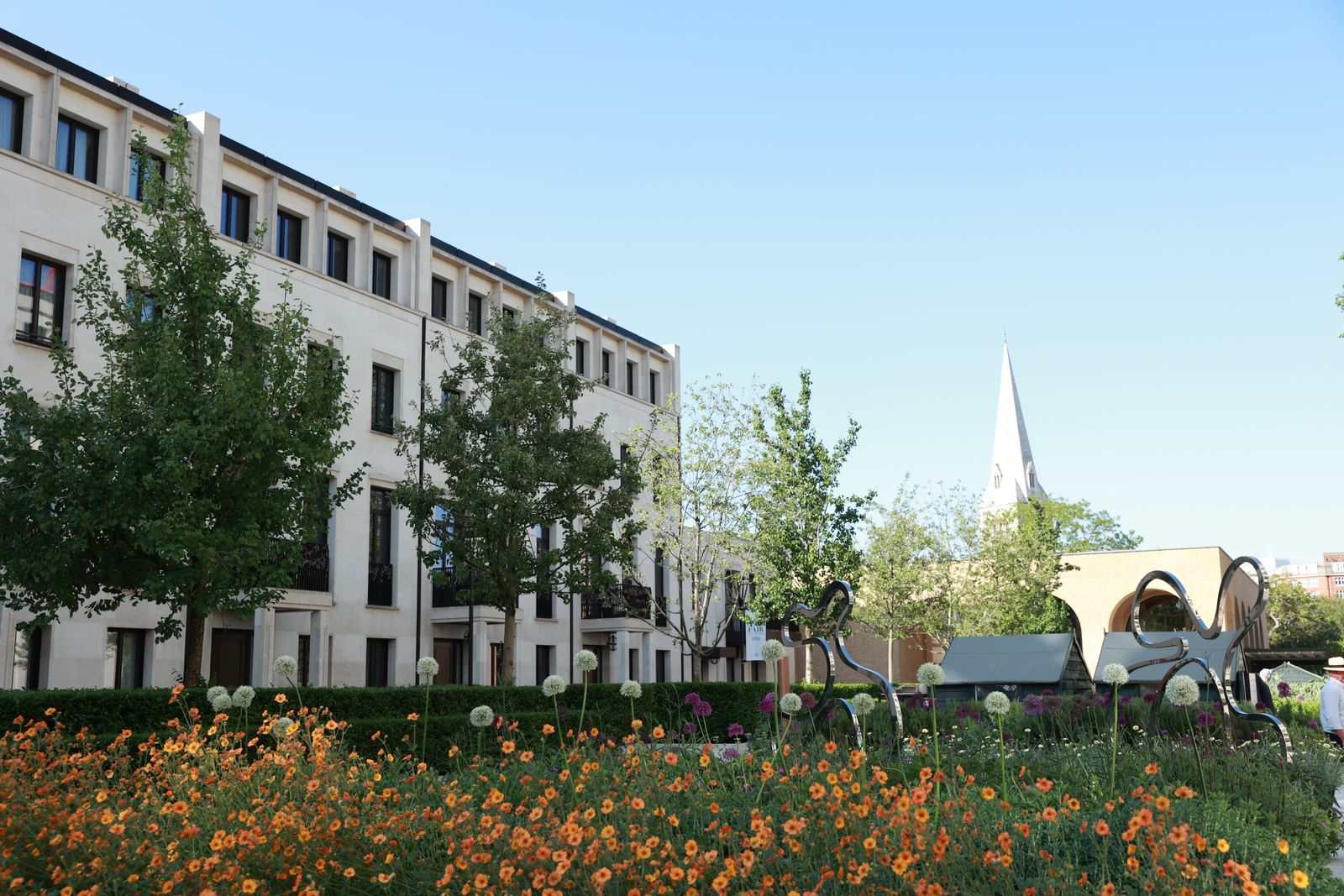 Image may contain Neighborhood City Grass Plant Urban Architecture Building Condo Housing and Office Building