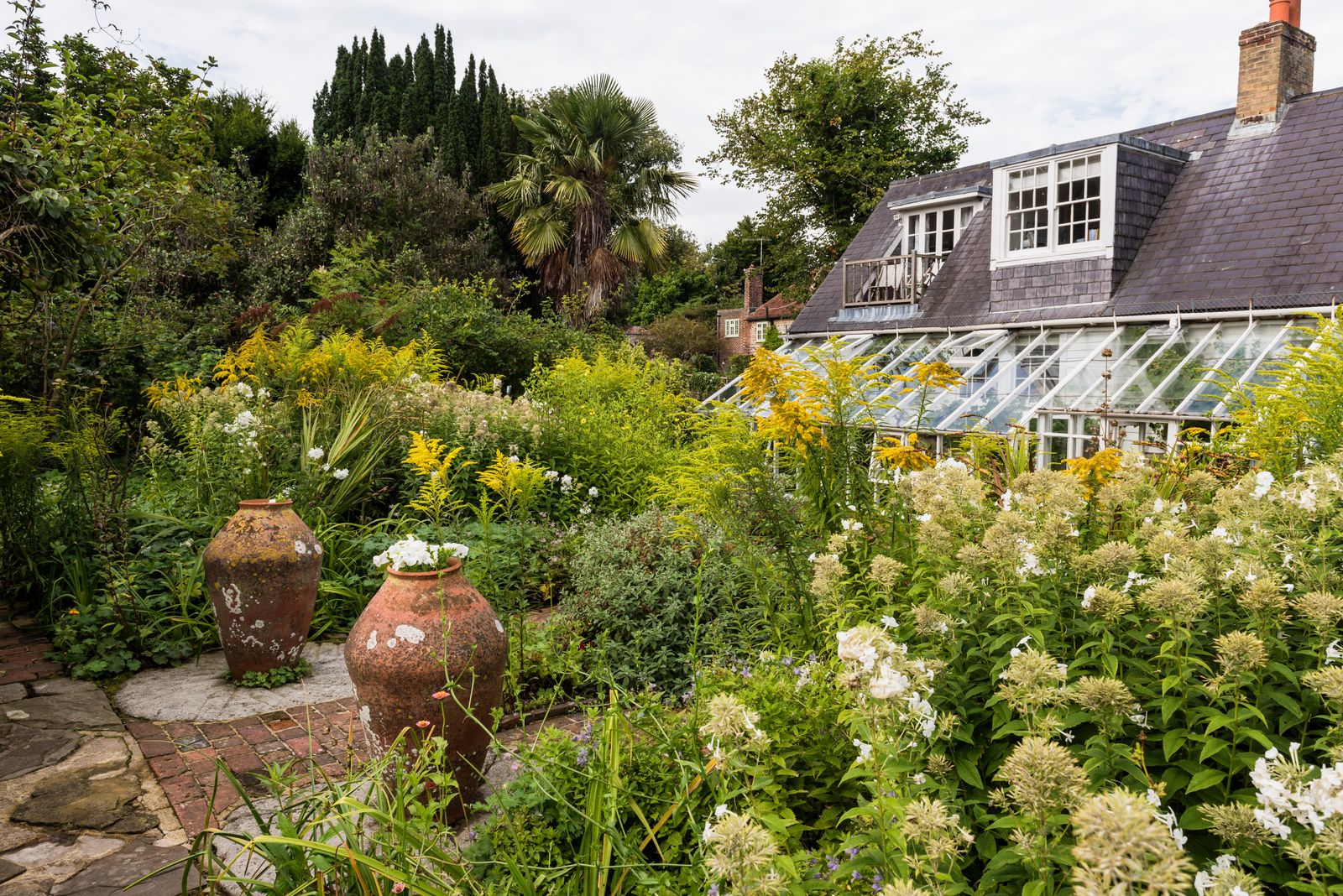 Image may contain Garden Nature Outdoors Architecture Building Cottage House Housing Plant Vegetation and Backyard