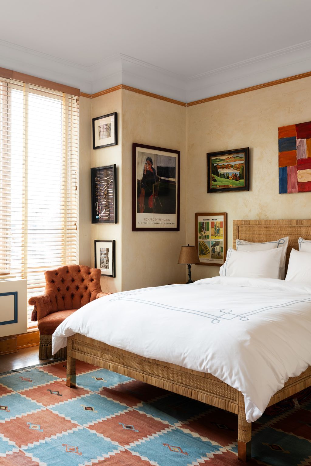 Image may contain Corner Lamp Home Decor Indoors Interior Design Bed Furniture Art Painting Rug and Person