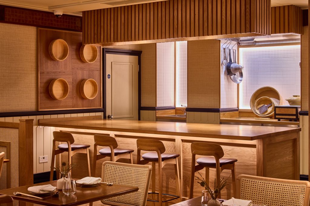 Image may contain Indoors Interior Design Architecture Building Dining Room Dining Table Furniture Room and Table