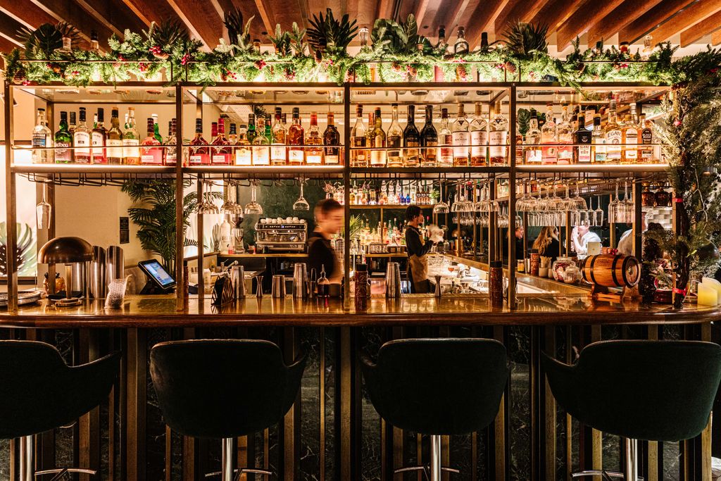 Image may contain Chair Furniture Bar Person Computer Hardware Electronics Hardware Monitor and Screen