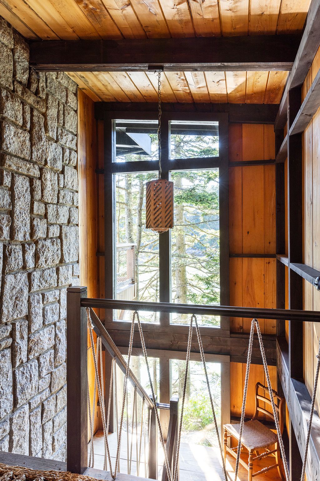 Image may contain Indoors Interior Design Wood Chair Furniture Hardwood Stained Wood and Wood Panels