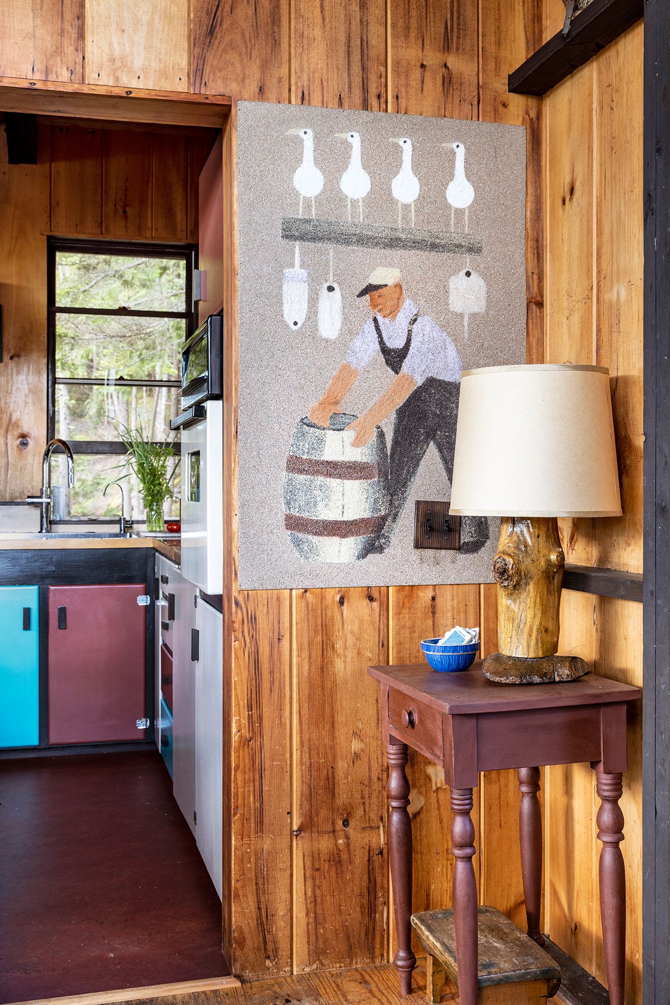 Image may contain Indoors Interior Design Wood Lamp Hardwood Sink Sink Faucet Clothing Hat Adult Person and Desk