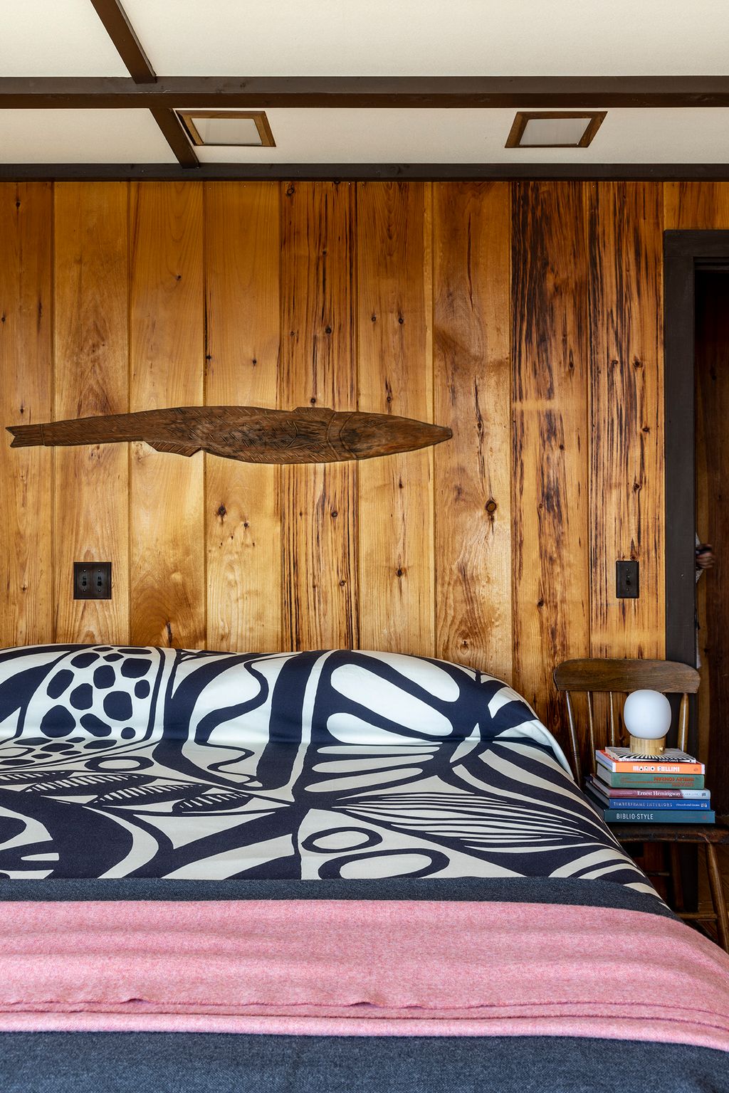 Image may contain Indoors Interior Design Hardwood Stained Wood Wood Wood Panels Bed and Furniture