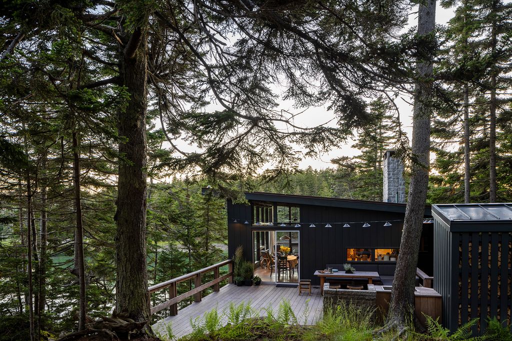 Image may contain Nature Outdoors Scenery Architecture Building Housing Desk Furniture Table House and Cabin