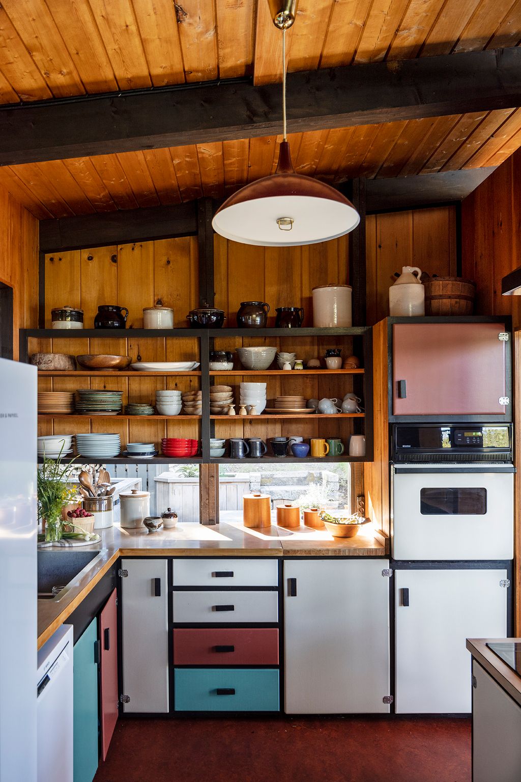 Image may contain Indoors Interior Design Kitchen Lamp Sink Plate Cup and Wood