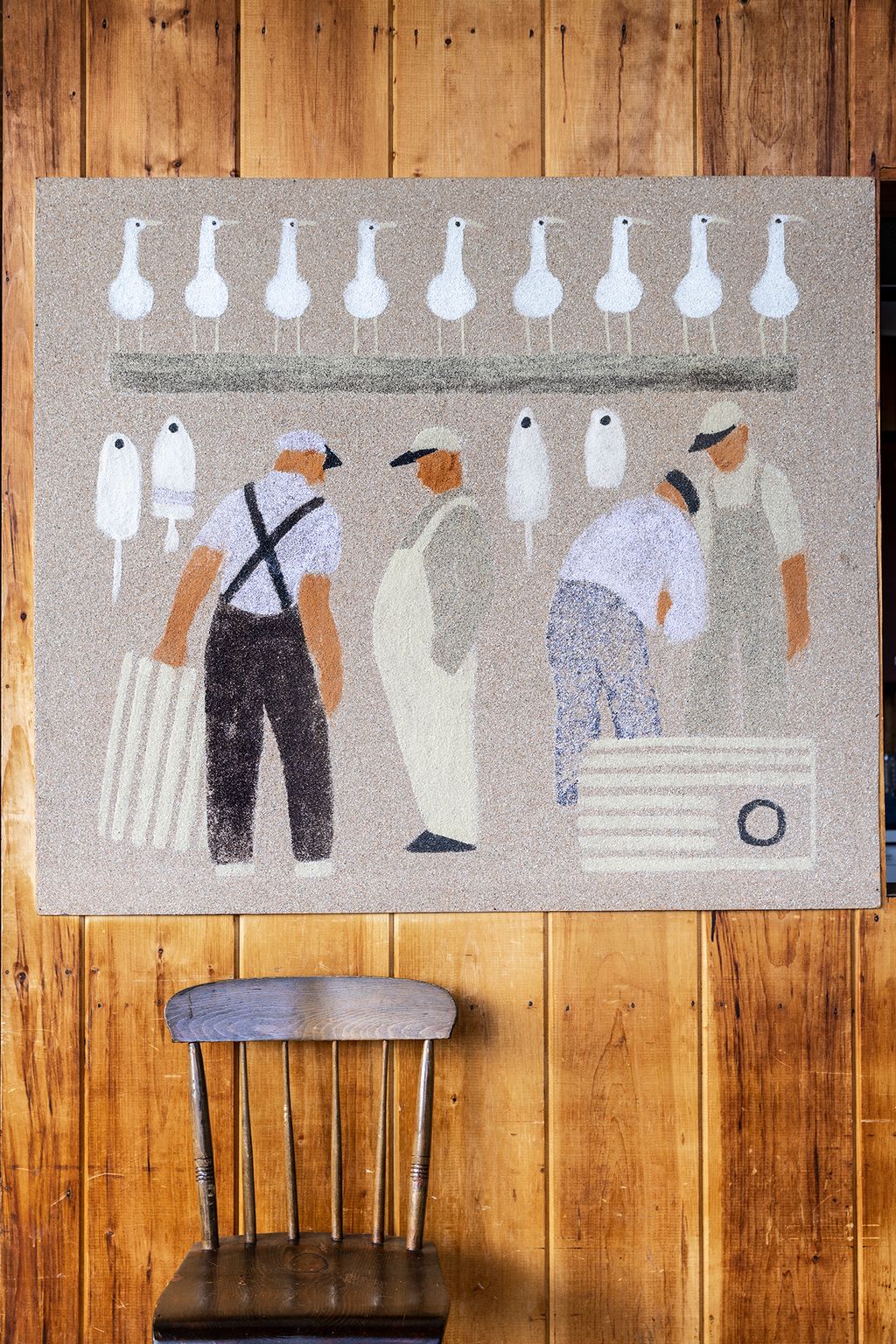 Image may contain Home Decor Rug Chair Furniture Adult Person Clothing Hat Accessories Bag Handbag and Indoors