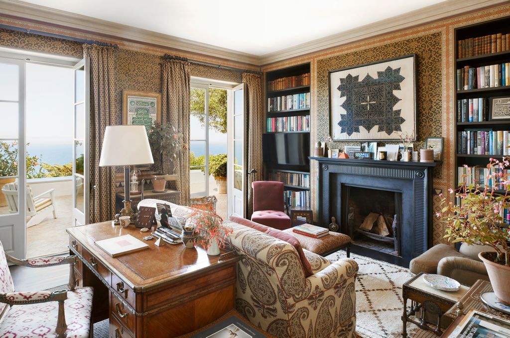 Image may contain Home Decor Lamp Book Publication Chair Furniture Couch Architecture Building and Indoors