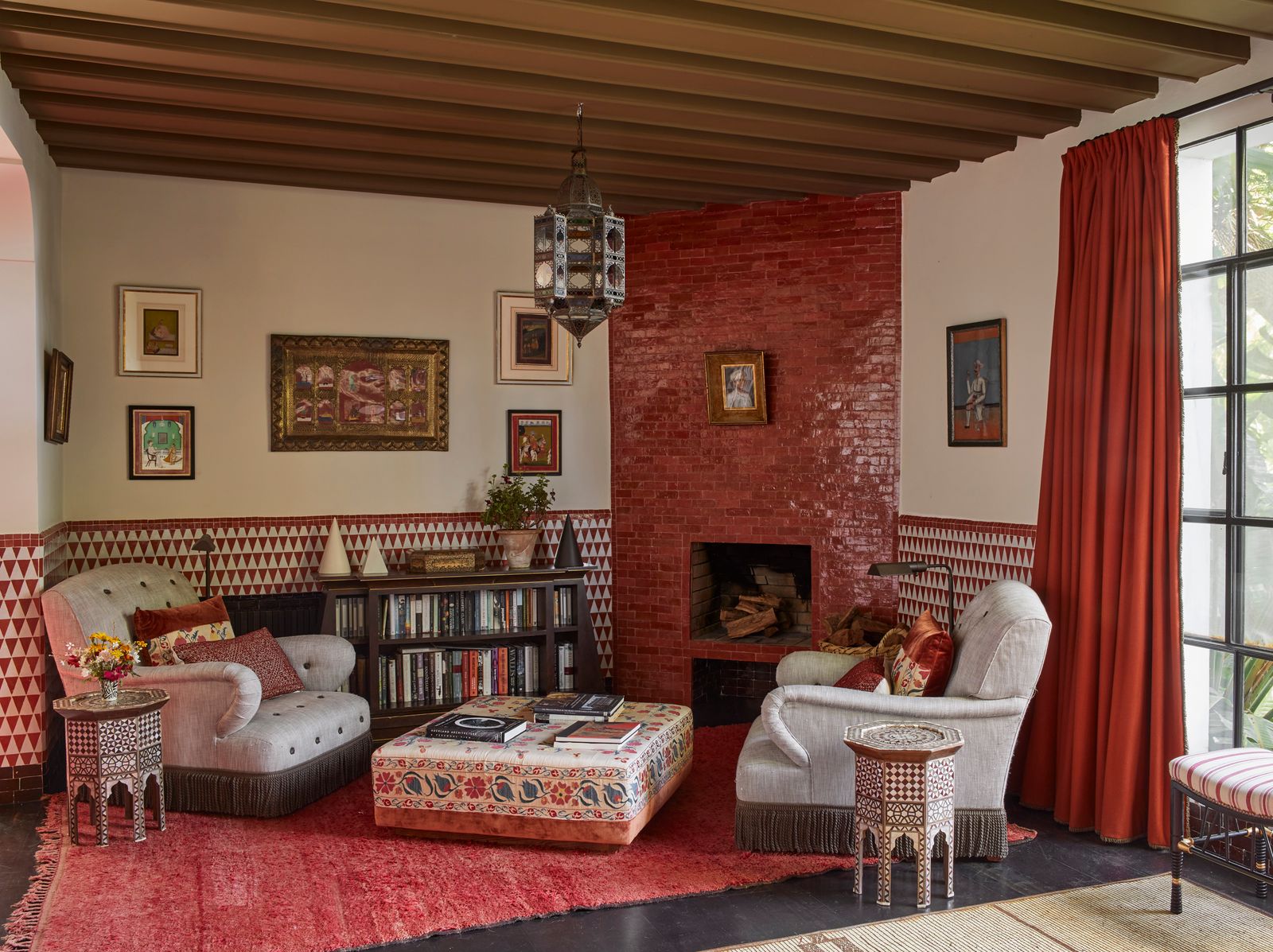 Image may contain Home Decor Lamp Art Painting Plant Couch Furniture Book Publication Architecture and Building