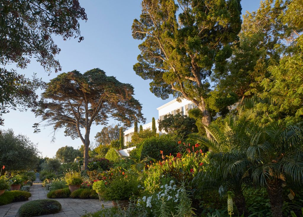 Image may contain Grass Nature Outdoors Park Plant Vegetation Garden Architecture Building House and Housing