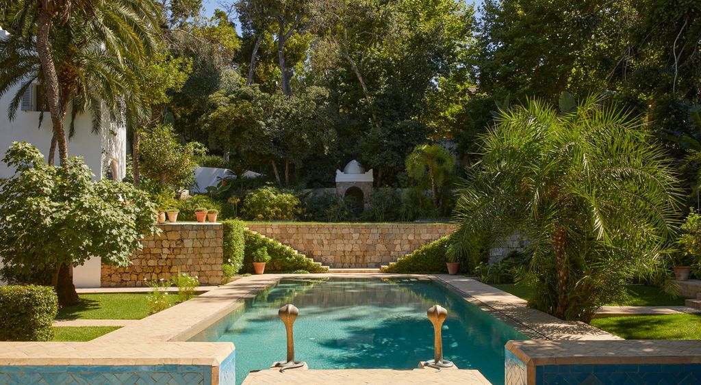 Image may contain Architecture Building House Housing Villa Pool Water Backyard Nature Outdoors and Yard