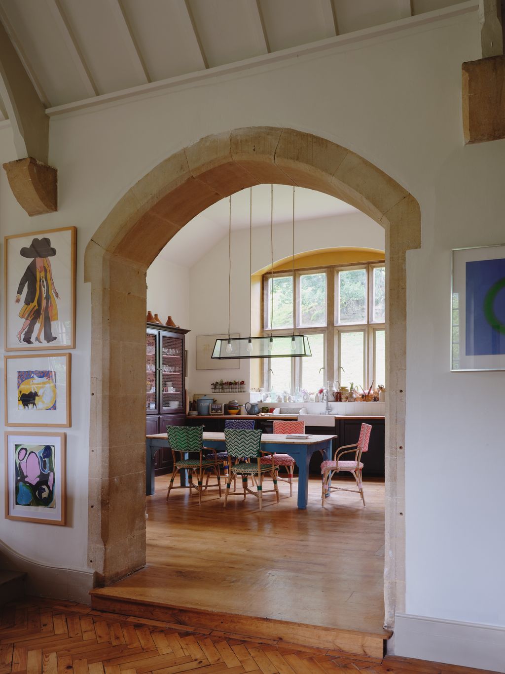 Image may contain Floor Flooring Arch Architecture Indoors Interior Design Wood Hardwood Chair Furniture and Art