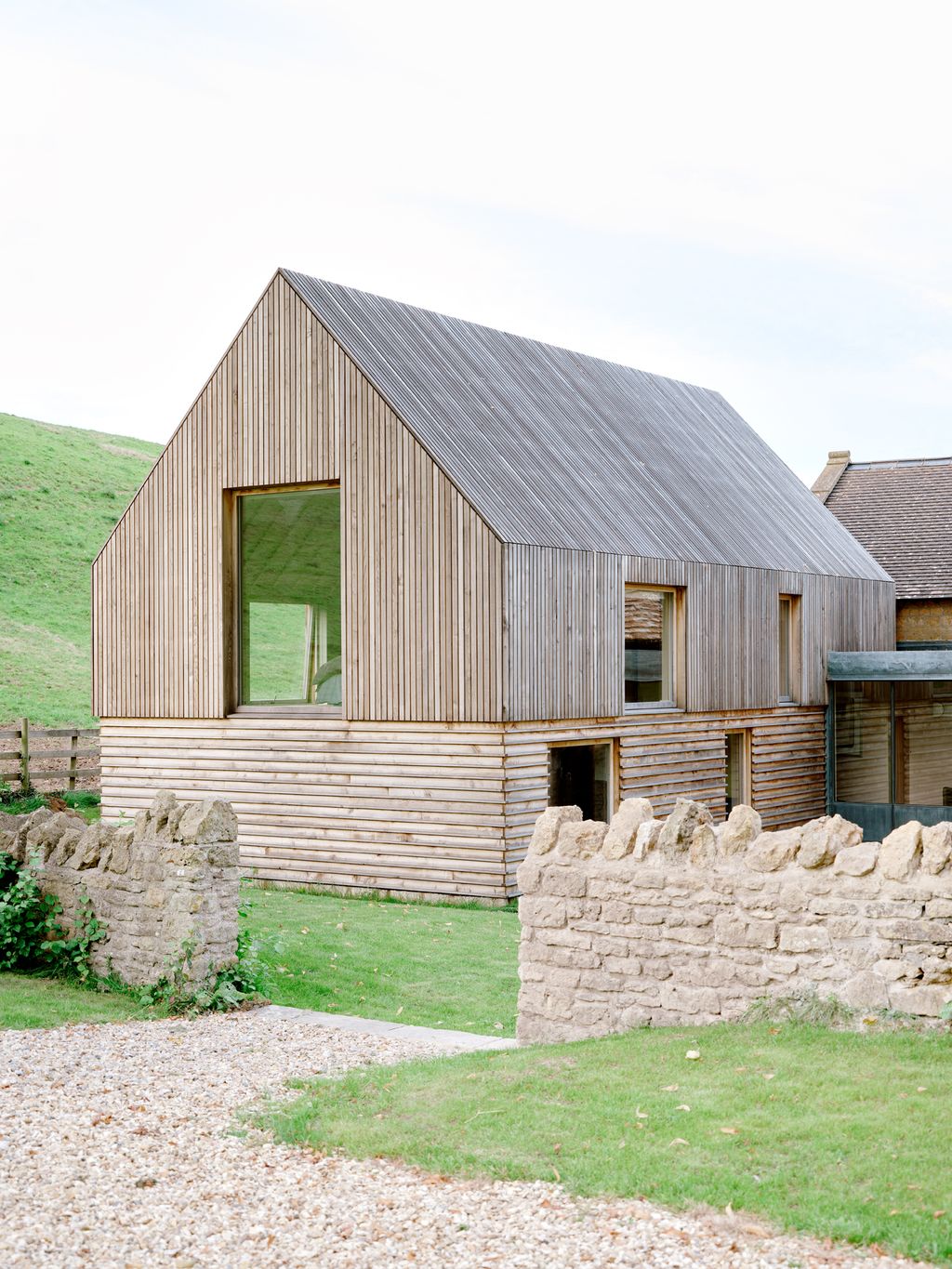 Image may contain Architecture Building Cottage House Housing Nature Outdoors Indoors Interior Design and Barn