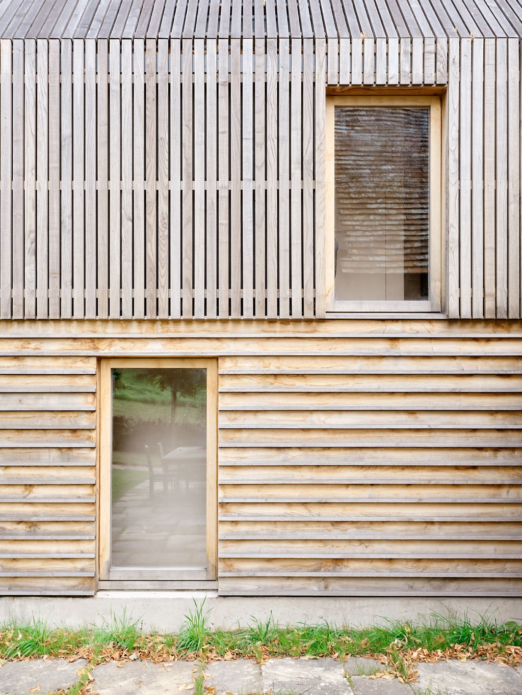 Image may contain Indoors Interior Design Wood Wood Panels Architecture Building Siding Chair Furniture and Nature