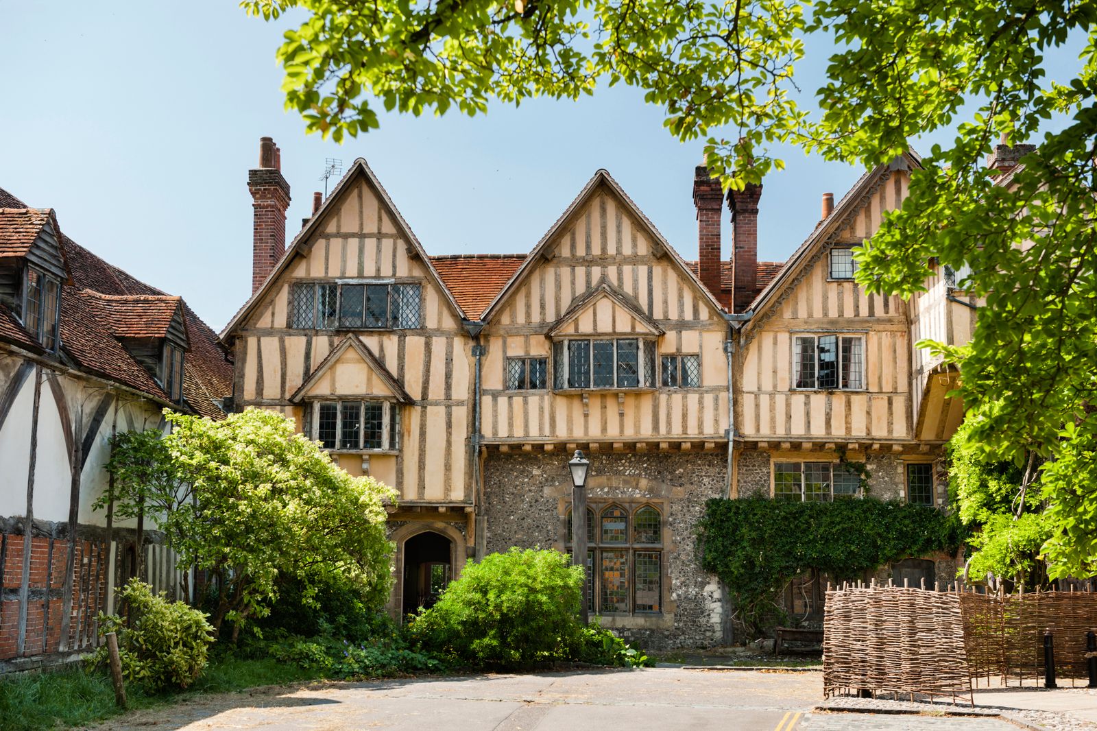 Image may contain Architecture Building Housing House Cottage Manor Bench Furniture and Person