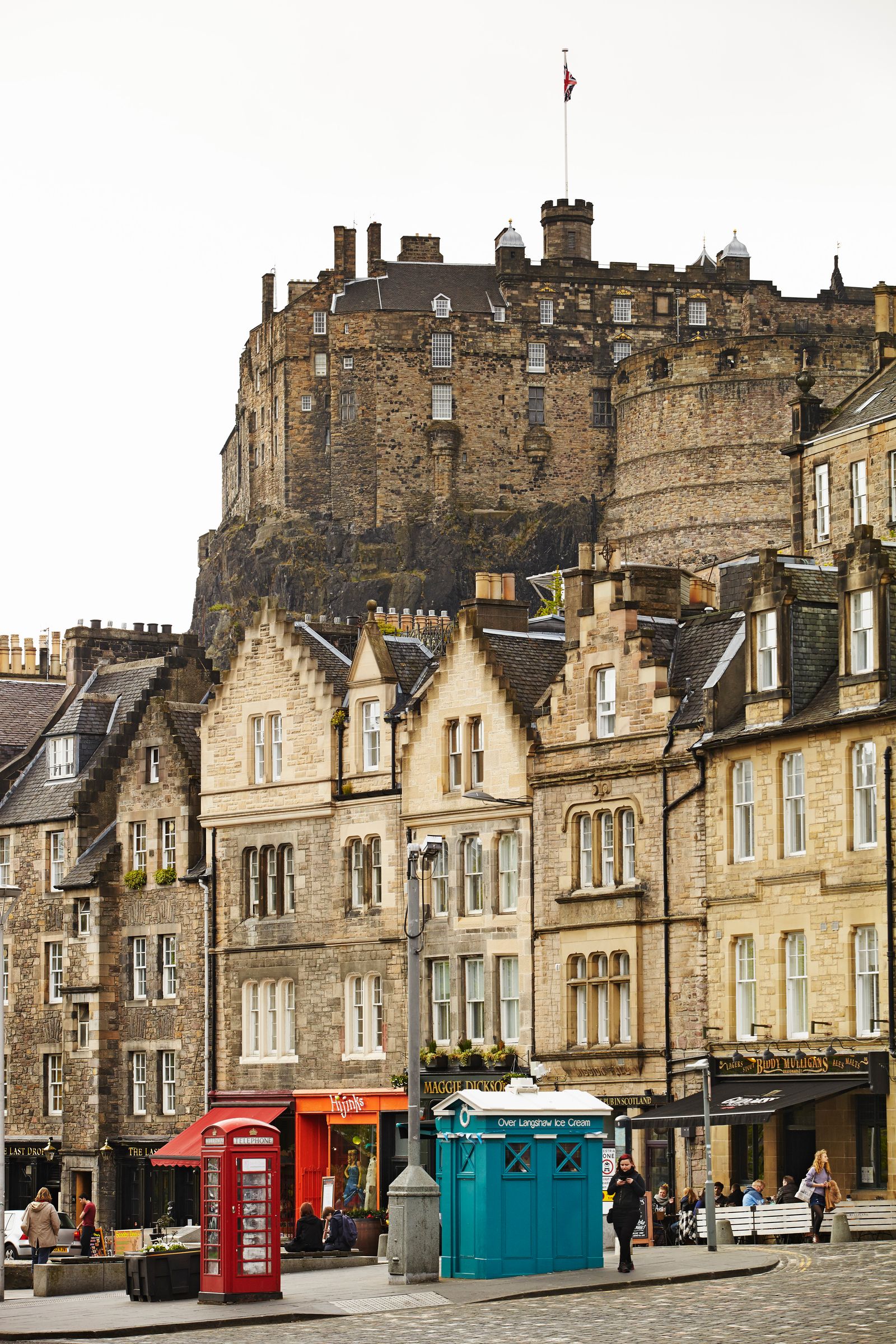 Image may contain City Person Car Transportation Vehicle Urban Accessories Bag Handbag Flag Plant and Bench