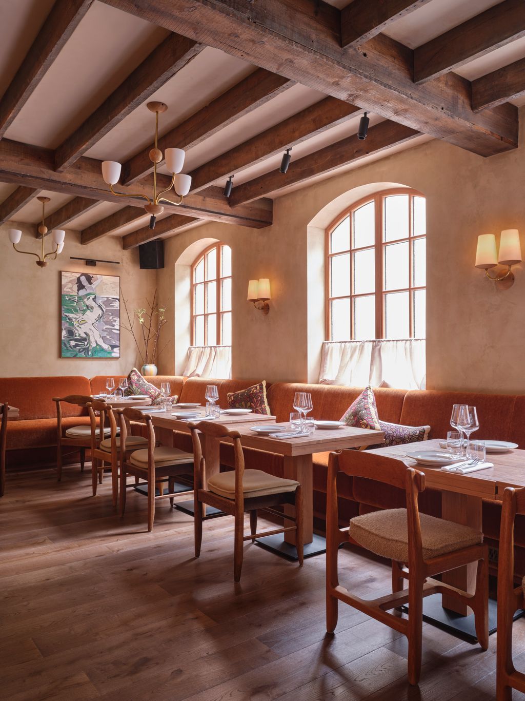Image may contain Indoors Restaurant Lamp Dining Table Furniture Table Interior Design Wood and Architecture