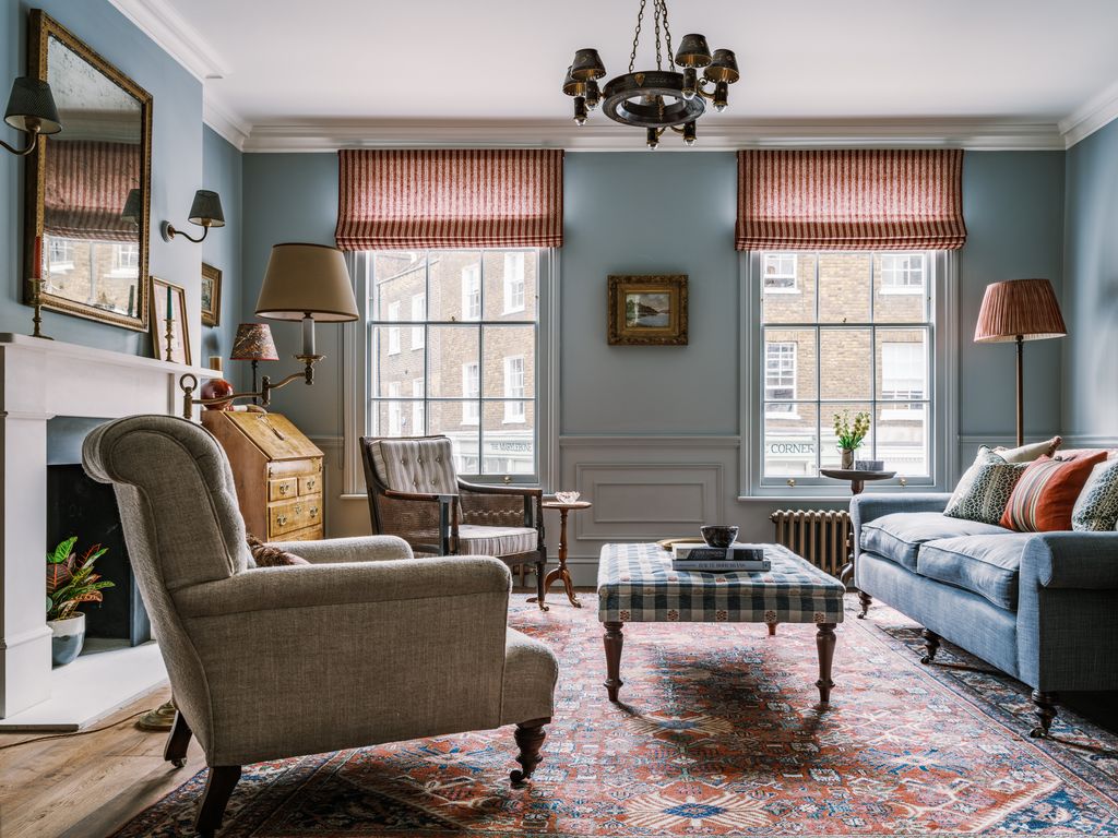 Image may contain Home Decor Couch Furniture Lamp Rug Plant Chair Art Painting Table Architecture and Building