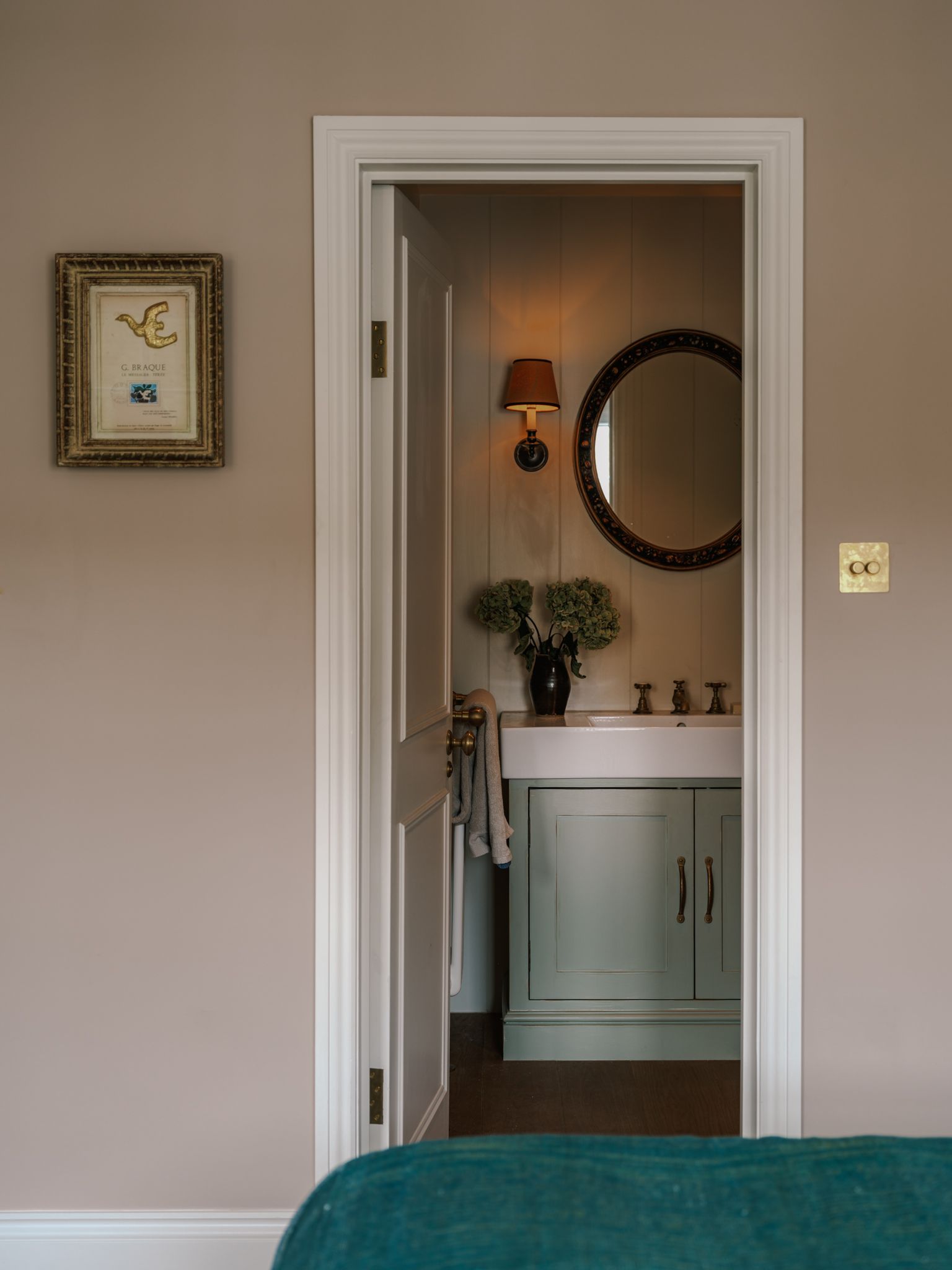 Image may contain Corner Indoors Interior Design Lamp Plant Door Photo Frame and Sink