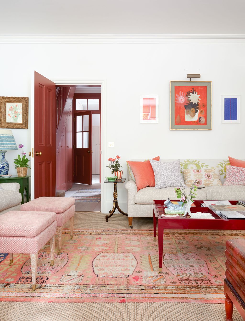 Image may contain Home Decor Rug Lamp Couch Furniture Desk Table Architecture Building Indoors and Living Room