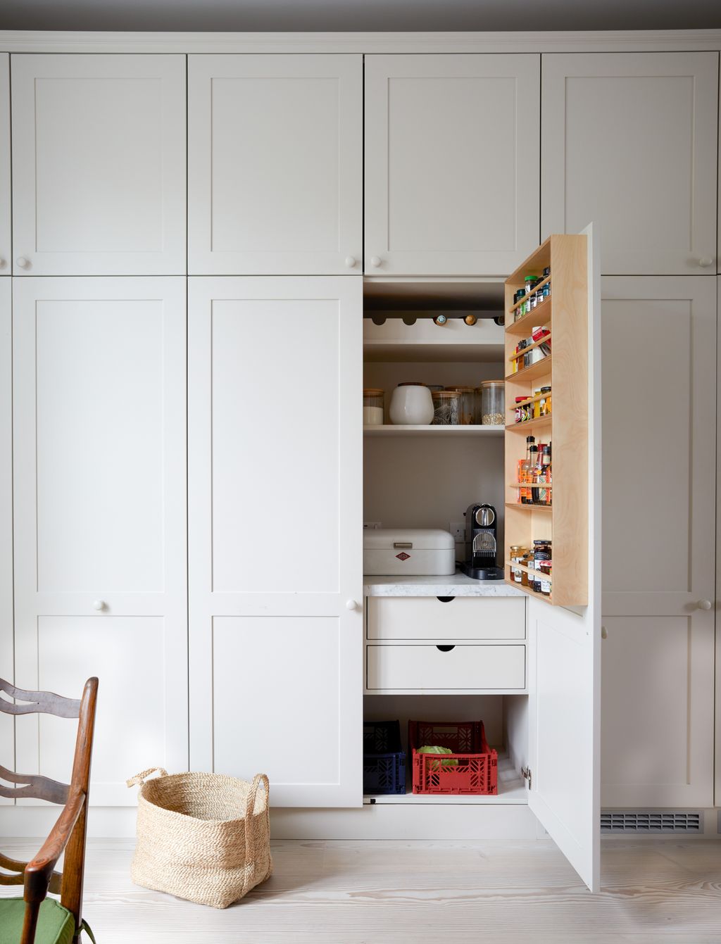 Image may contain Shelf Closet Cupboard Furniture Chair Indoors Interior Design Accessories Bag Handbag and Box