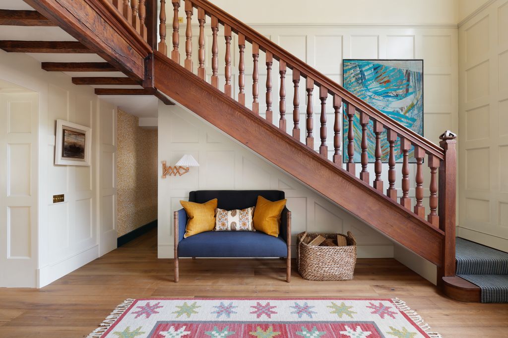 Image may contain Architecture Building House Housing Staircase Furniture Indoors Living Room and Room